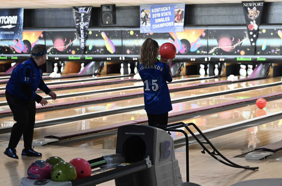 Carson Vieth (12) and partner athlete Addy Stepner (12) support eachother while bowling. 